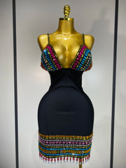 Black dress with colorful beaded top on a mannequin against a neutral background