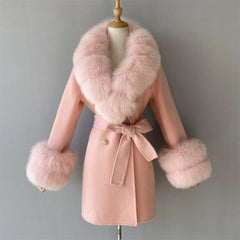 Pink coat with fur trim on a mannequin against a gray background