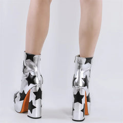 Black and white star-patterned platform boots on a white background