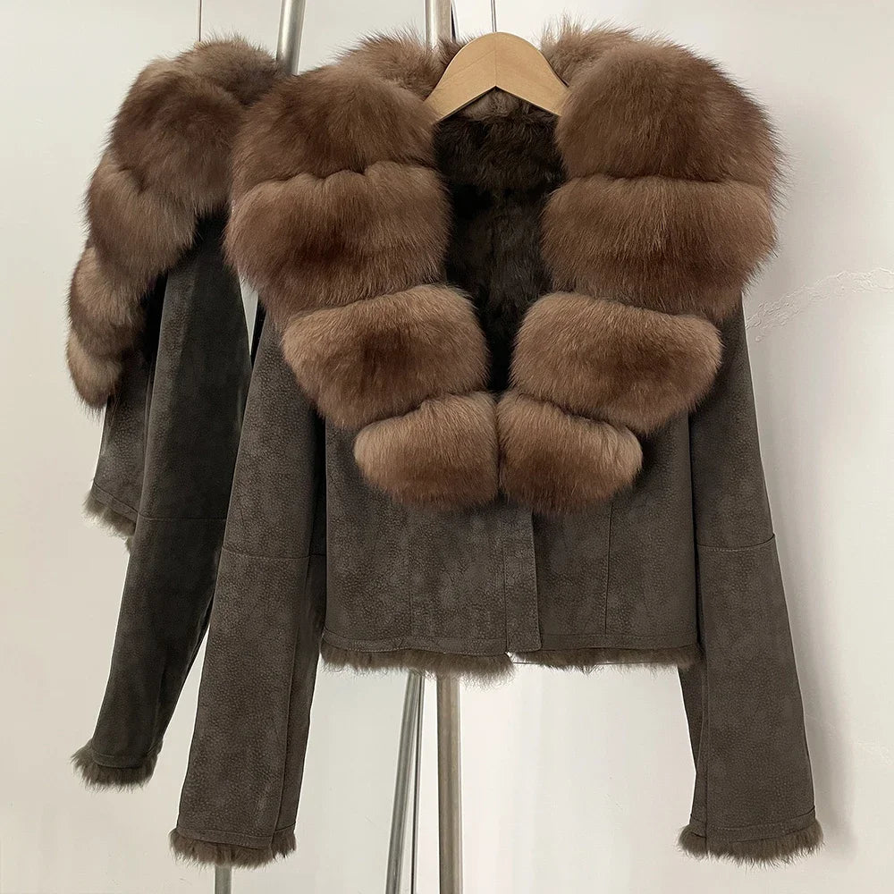 Brown suede jacket with fur trim on a hanger against a white background