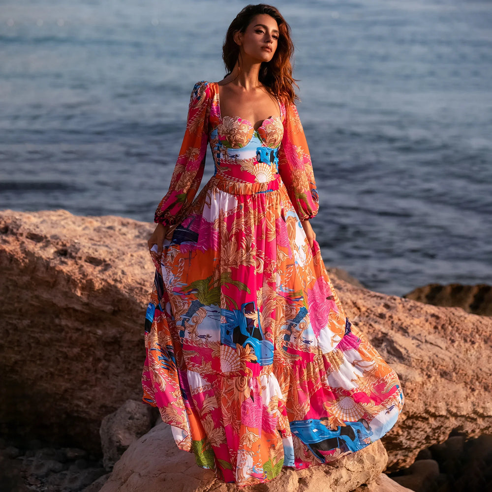 Long sleeve printed one piece swimsuit and skirt beachwear set on a model.