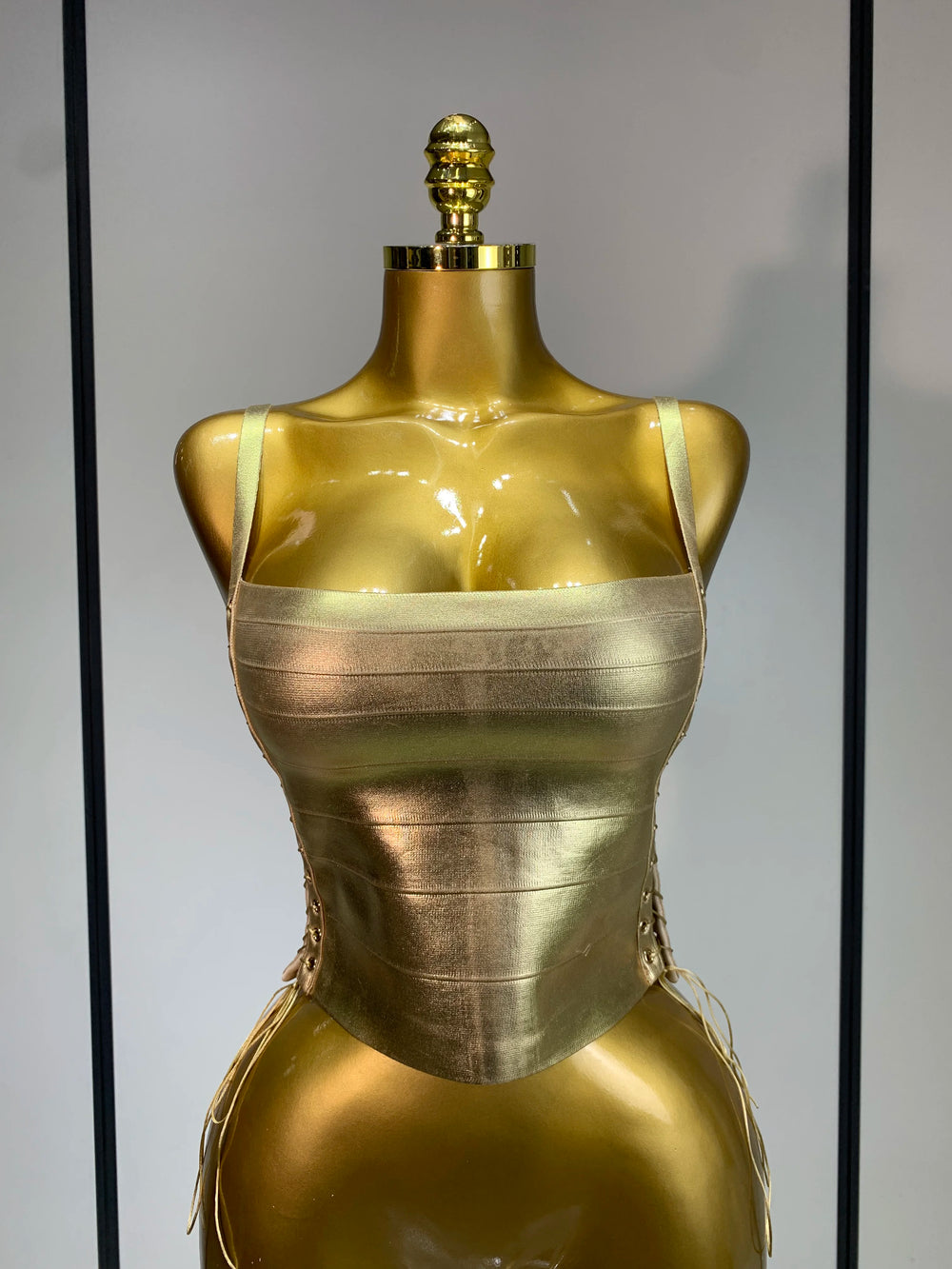 Gold bandage corset top with lace-up back detail