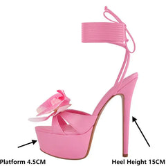 Side profile of pink platform stiletto sandals with heel and platform measurements