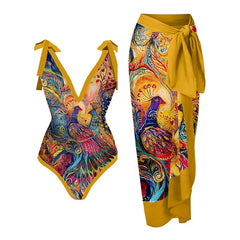 Colorful peacock feather print one-piece swimsuit with tie straps and a matching yellow sarong.