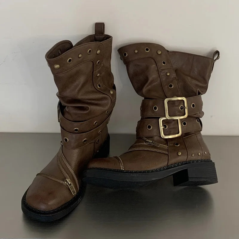Brown studded ankle boots with buckle and zipper details