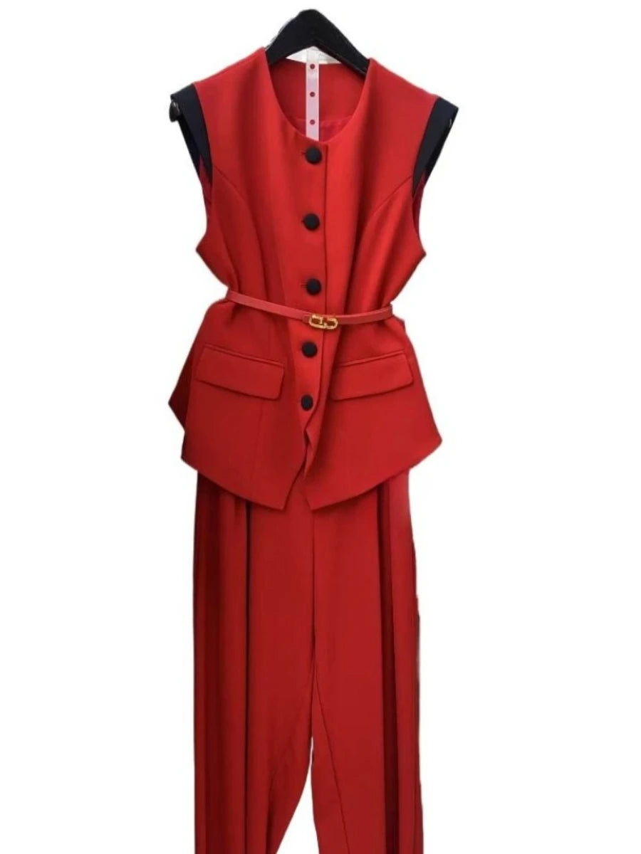 Red vest and pants set on a hanger with a white background