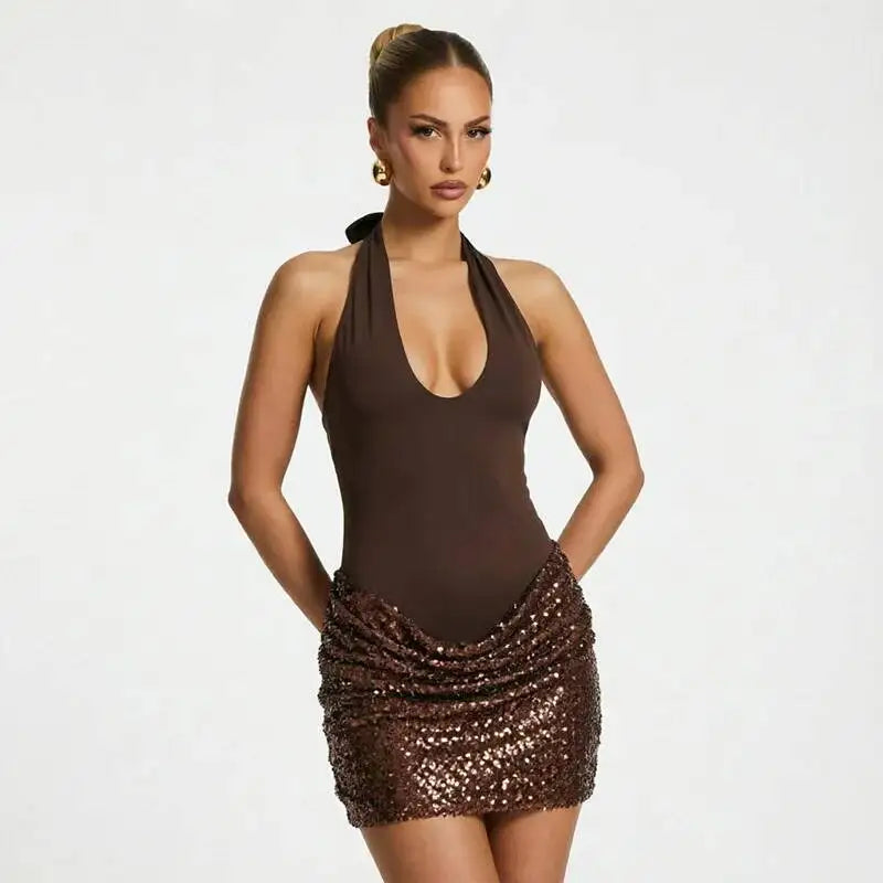 Close-up of ruched sequin skirt detail on mini dress