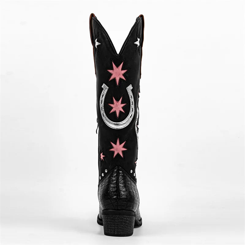Black cowboy boot with pink stars and a silver horseshoe on a white background