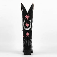 Black cowboy boot with pink stars and a silver horseshoe on a white background