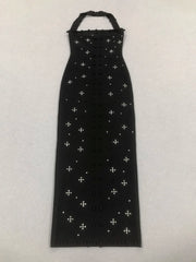 Black dress with white cross patterns on a white background