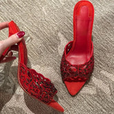 Red suede stiletto slides with crystal cutout detail