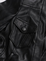 Close-up of a black leather jacket with a buttoned pocket.