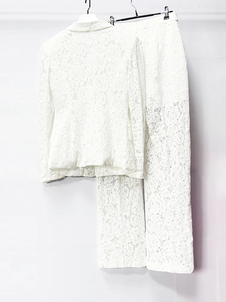 White lace outfit on a hanger against a white background