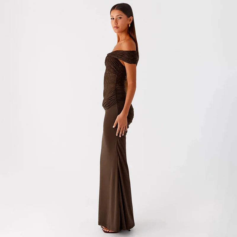 Woman wearing a brown off-shoulder evening gown on a white background