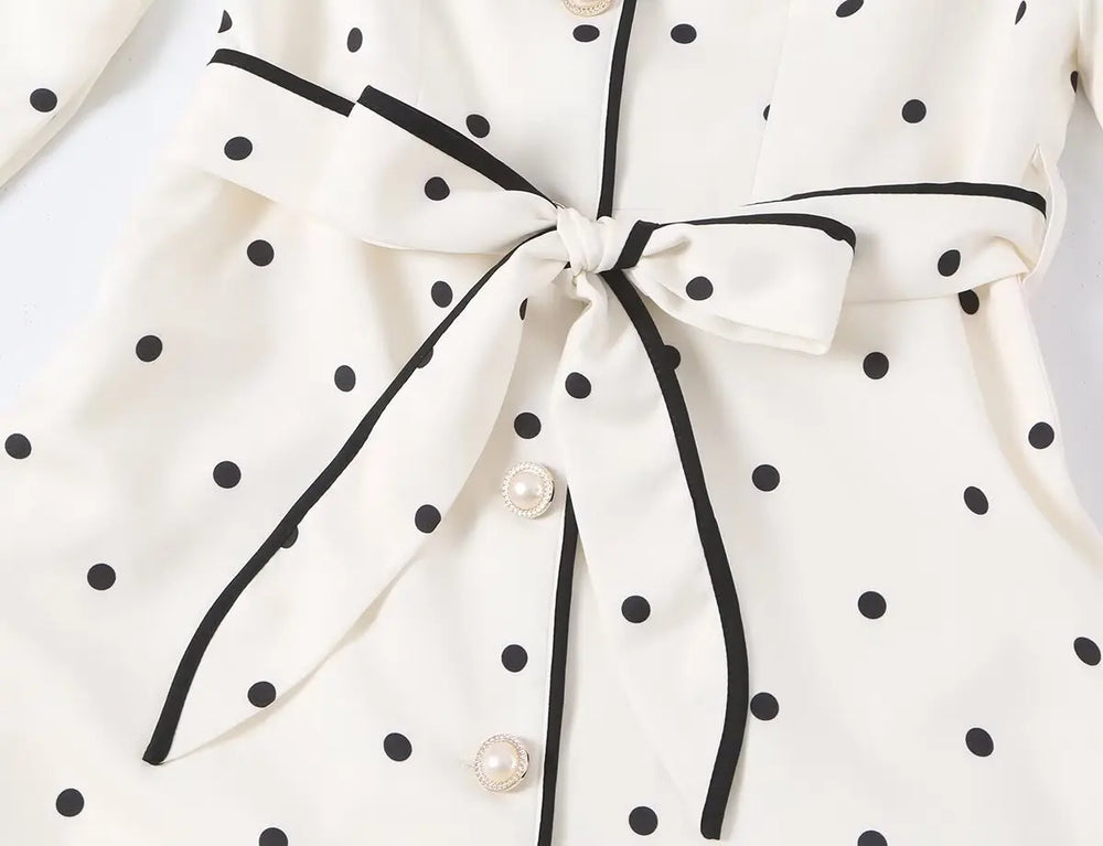 Close-up of the polka dot notched collar coat tie sash