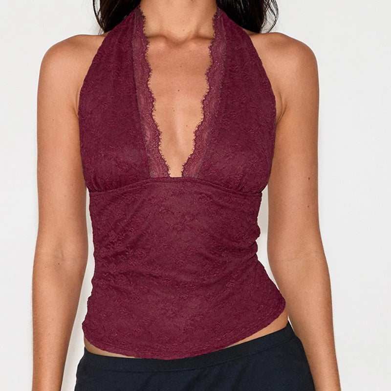 Maroon lace halter top worn by a person on a white background
