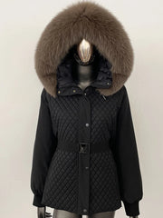 Black quilted jacket with large fur hood on a mannequin against a white background