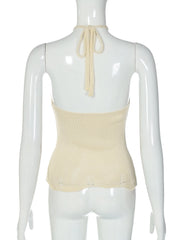 Beige halter top on a mannequin against a white background