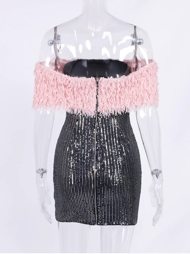 Mannequin wearing a dress with pink top and black sequin skirt on a white background