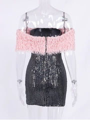Mannequin wearing a dress with pink top and black sequin skirt on a white background