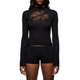 Black long-sleeve top and shorts set with a decorative pattern