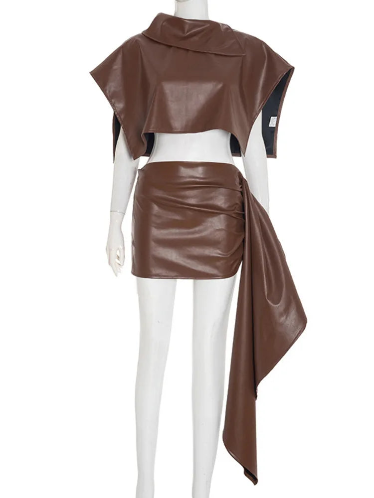 Brown leather outfit on a mannequin against a white background