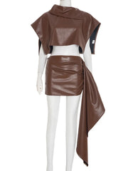 Brown leather outfit on a mannequin against a white background