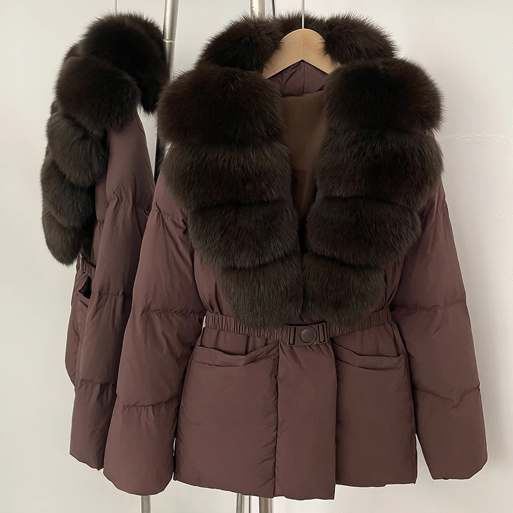 Brown puffer jacket with fur hood on a hanger against a white background
