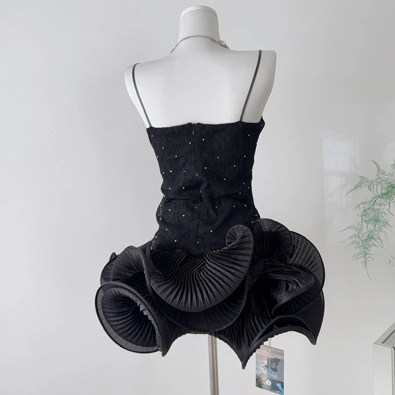 Rhinestone embellished wavy ruffled mini dress back view.