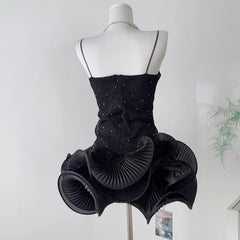 Rhinestone embellished wavy ruffled mini dress back view.