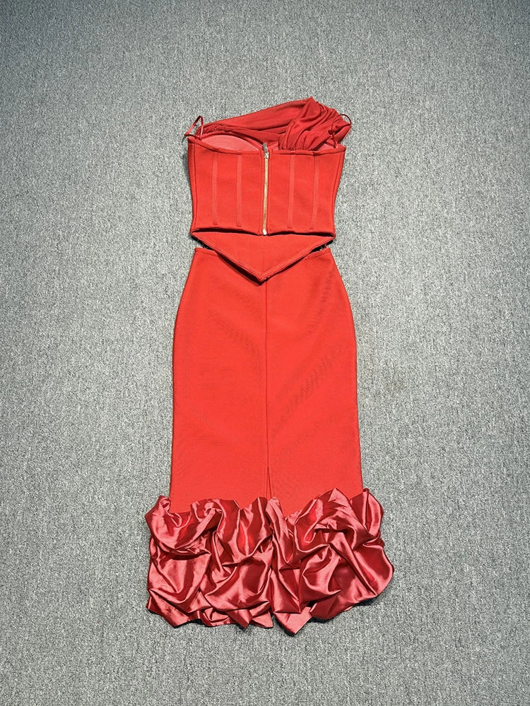 Red one-shoulder dress with ruffled hem on a gray background