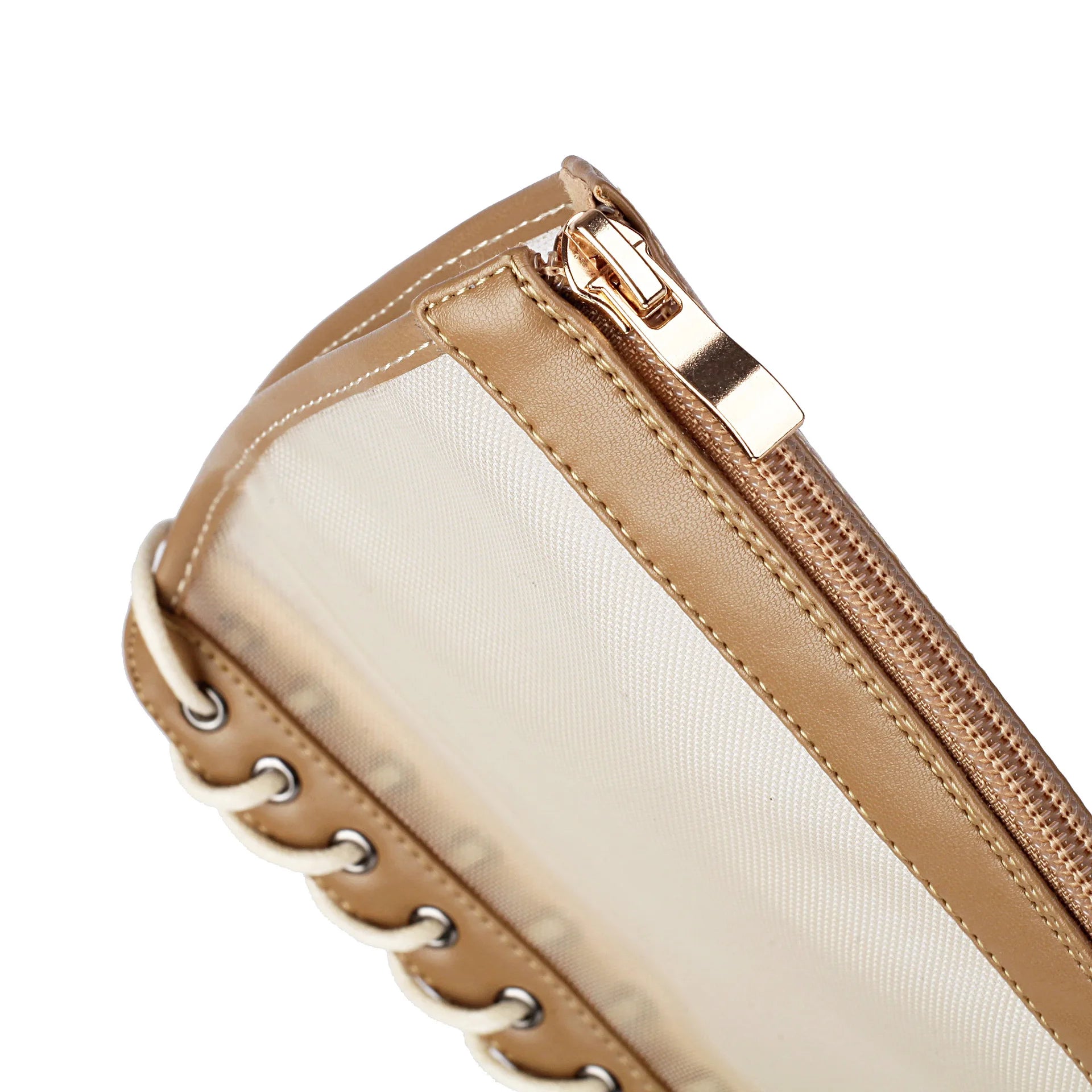 Close-up of a beige handbag with a gold zipper