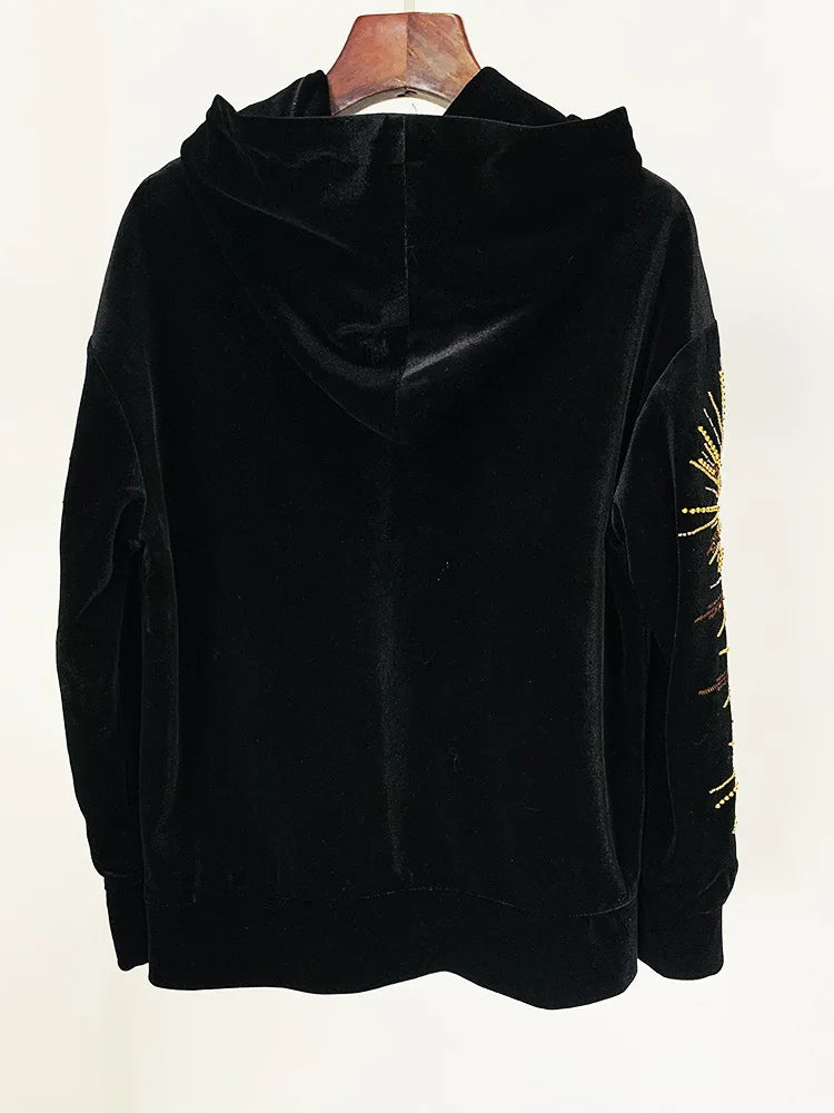 Back view of a black velvet hoodie.