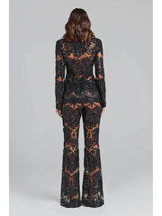 Rear view of the black sequin embroidered lace blazer and flare pants set.