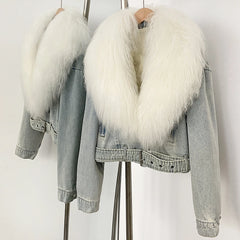 Denim jacket with white fur collar on a stand against a white background