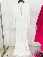 Front view of white long-sleeve jumpsuit with rhinestone embellished cutout