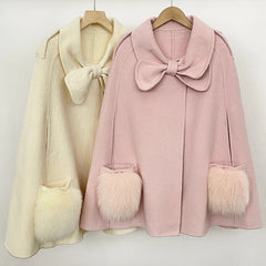 Pink and beige cape coats displayed together