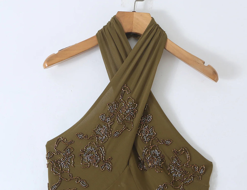 Close-up of the beaded neckline on the halter midi dress