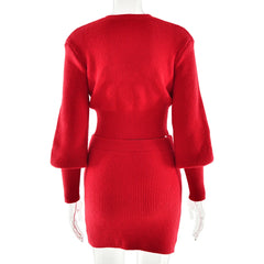 Red ribbed dress on a mannequin against a white background