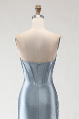 Silver evening gown on a mannequin with a plain background