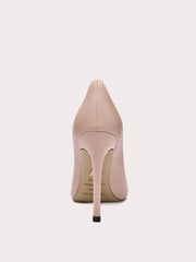 Nude-colored high-heeled shoe on a light beige background