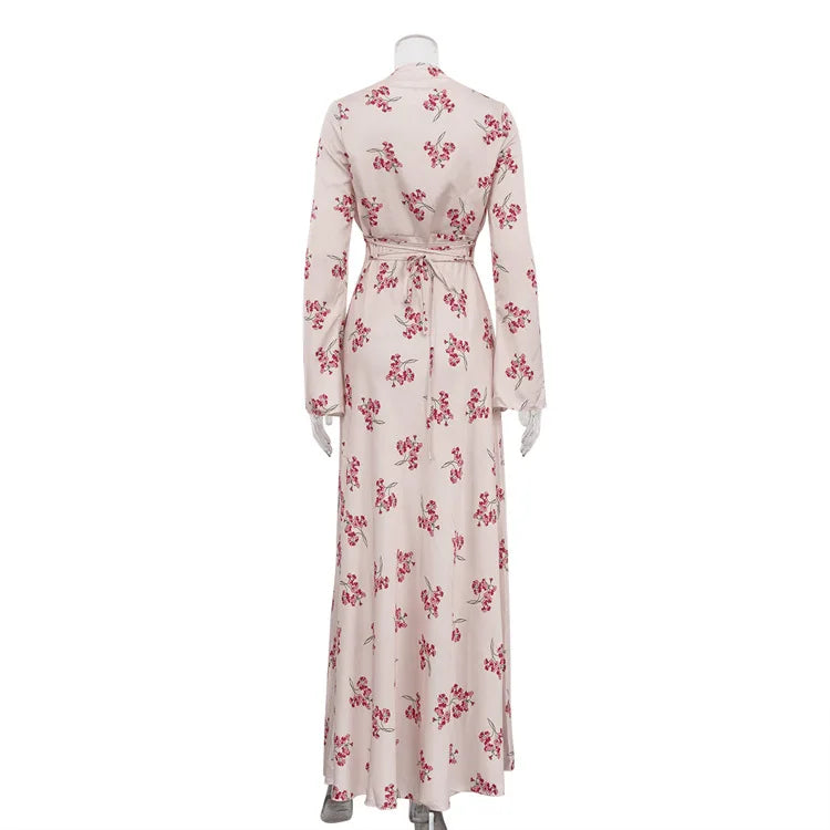 Floral dress on a mannequin against a white background