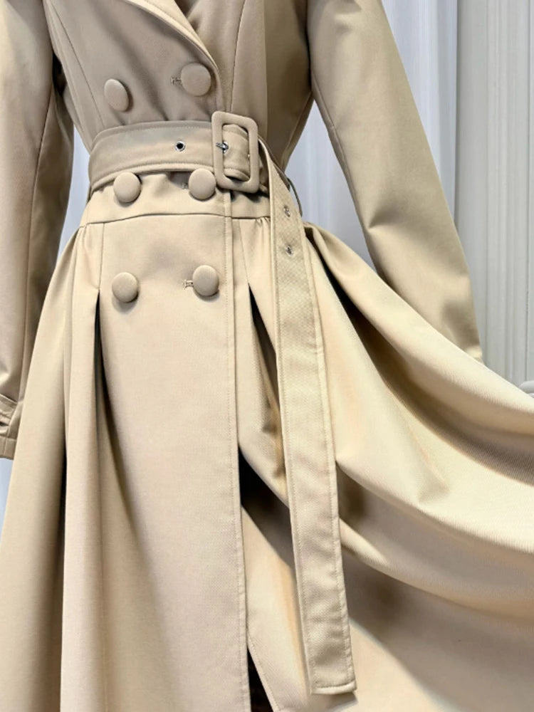 Close-up of tan turn-down collar double breasted midi dress belt and buttons