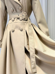 Close-up of tan turn-down collar double breasted midi dress belt and buttons