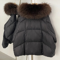 Black puffer jacket with fur hood on a white background