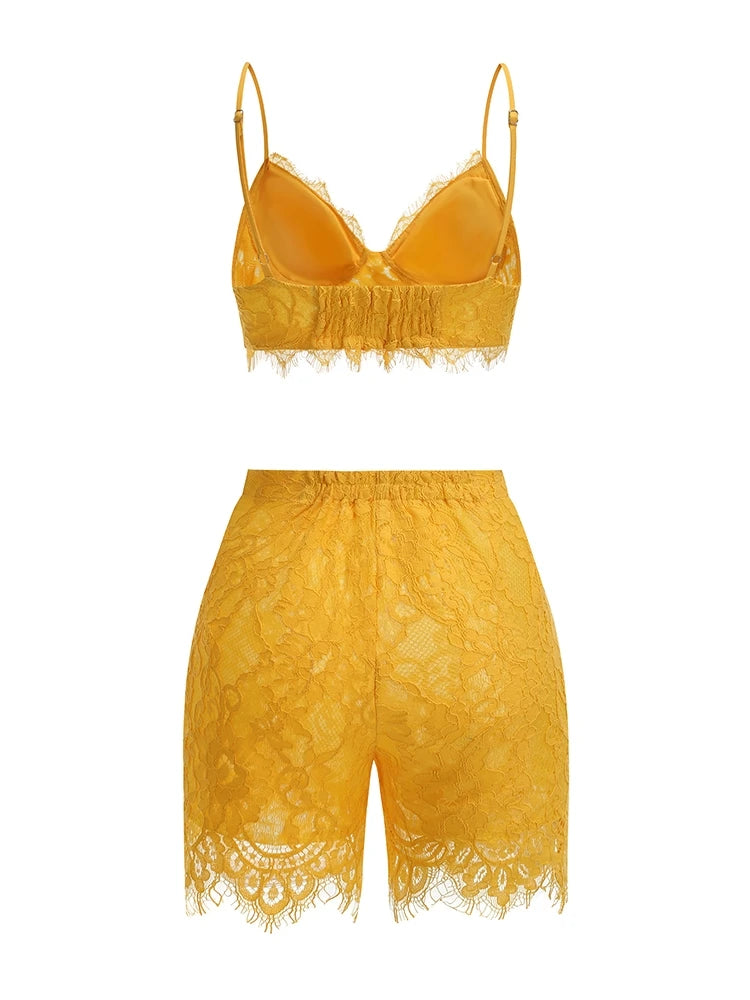Yellow lace lingerie set on a white background