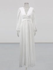White dress on a mannequin against a light gray background