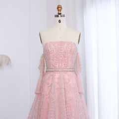 Pink strapless dress on a mannequin against a white background