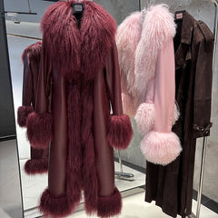 Fur-trimmed coat displayed in a store setting with other coats.