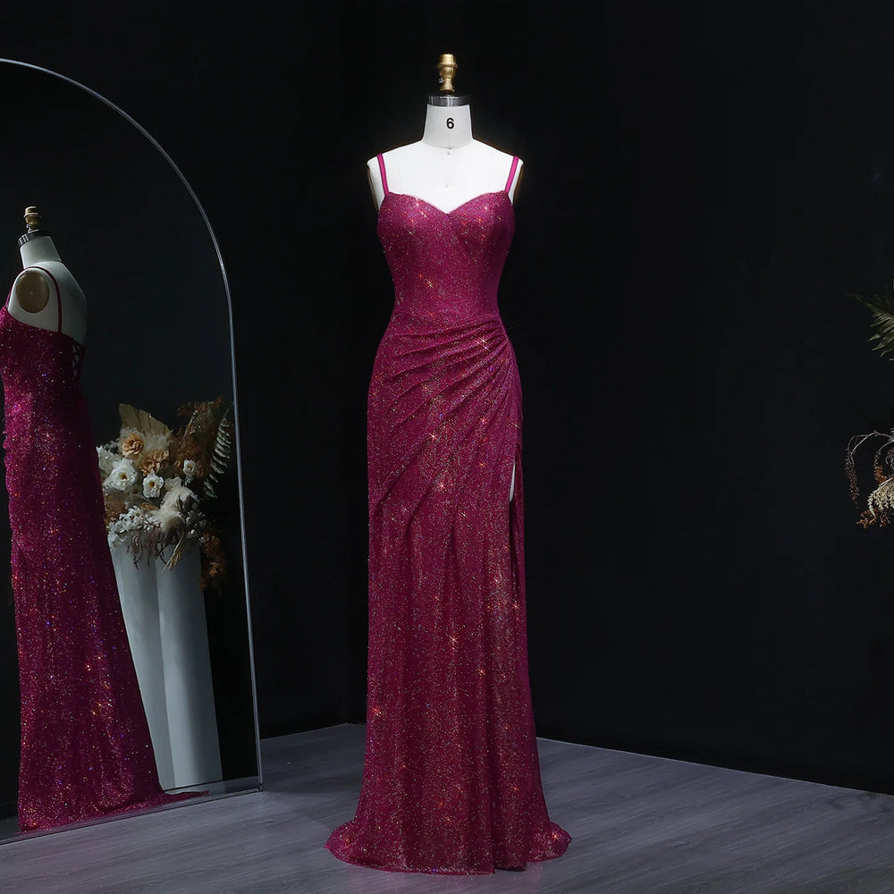 Magenta evening gown on a mannequin against a dark background